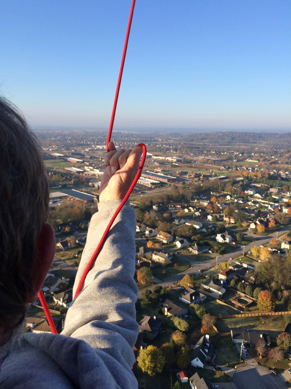 Bob flying with the vent line in his hand